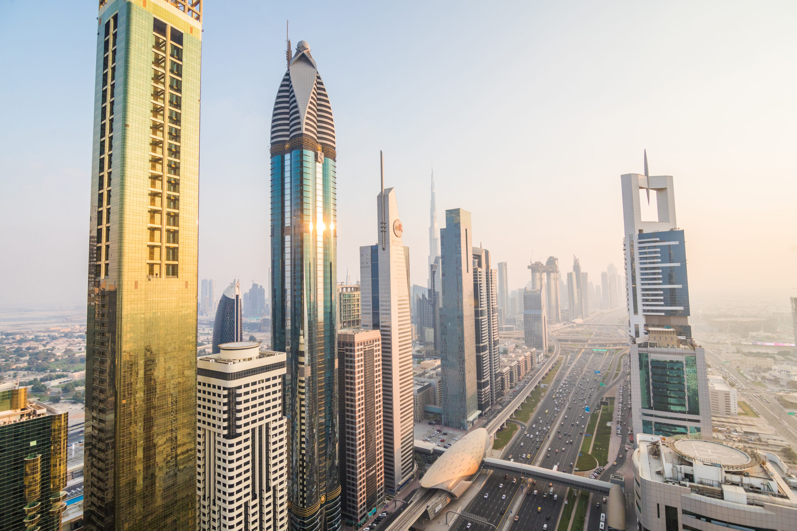 Dubai, UAE - October, 2018. Dubai skyline and downtown skyscrapers on sunset. Modern architecture with highrise buildings on world famous metropolis in United Arab Emirates